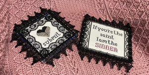 SUBMIT and SINNER framed cross stitch